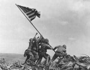 United States Marines raising the American Flag over Iwo Jima in WWII