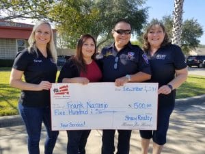 Homes for Heroes Specialists present displaced firefighter with $500 gift