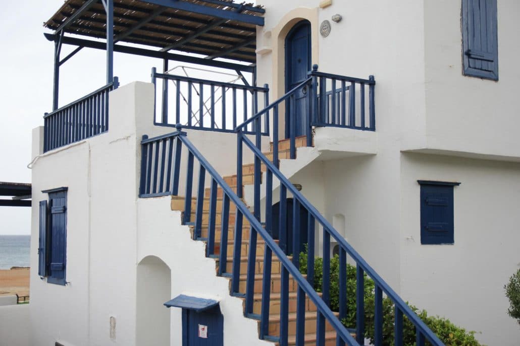 off white dark blue exterior paint colors on home with outside staircase
