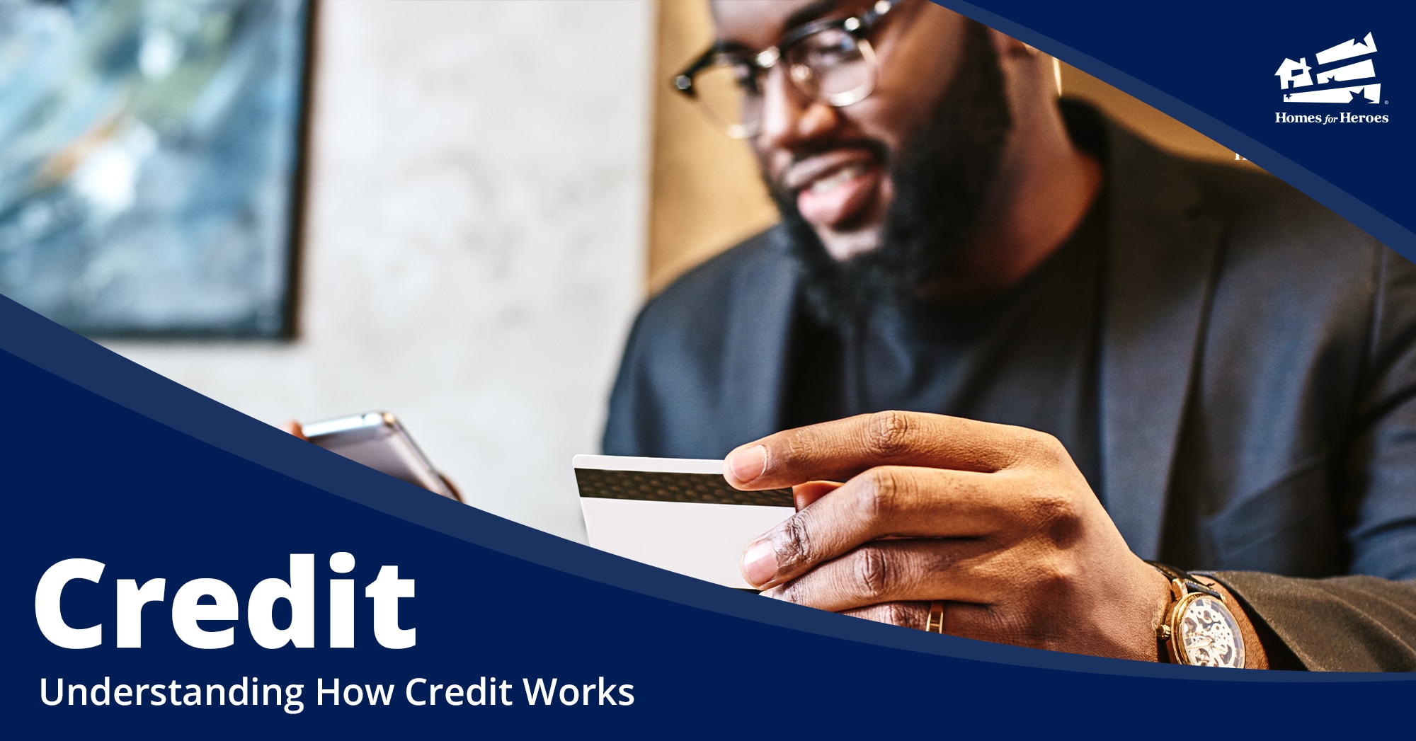 A man holding a credit card is looking at his credit score on a paper statement