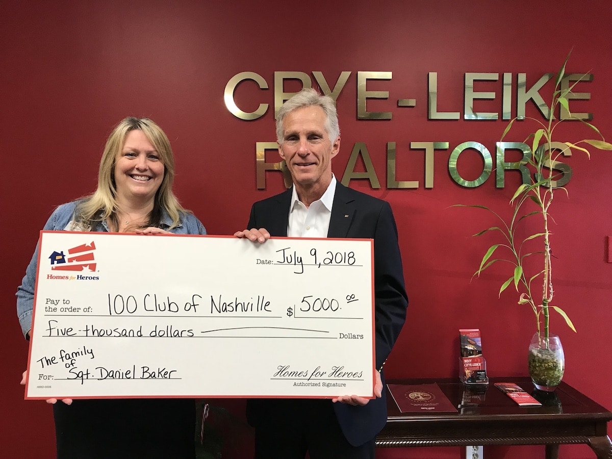 Homes for Heroes specialist, Barbara Bell presentes the 100 Club of Nashville with $5,000 grant on behalf of the Homes for Heroes Foundation