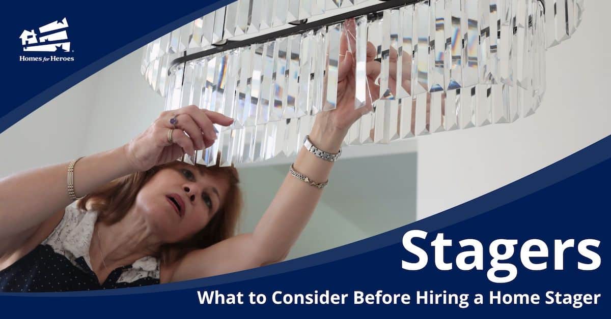 home-stagers-woman-fixing-crystal-on-hanging-light-staging-home-for-sale-Homes-for-Heroes