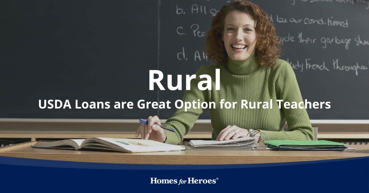 rural high school teacher sitting at desk in front of black board considering USDA home loans for teachers with Homes for Heroes