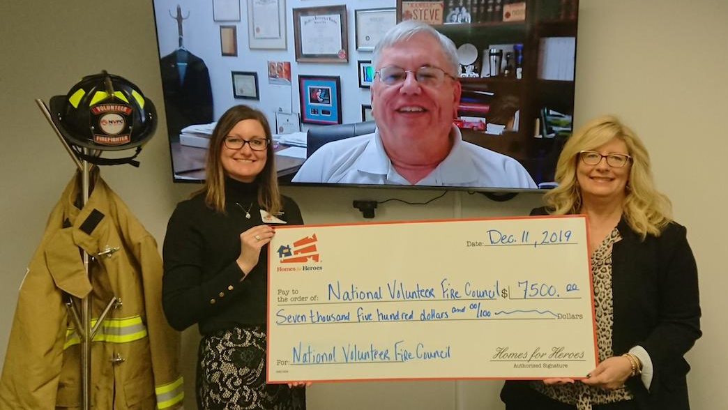 A Large Check presentation for the National Volunteer Firefighter Council presented by the Homes for Heroes Foundation
