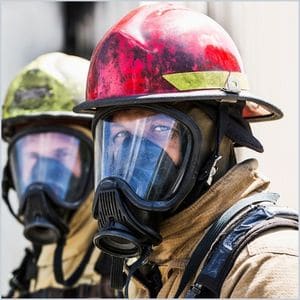 headshot of two firefighter trainees looking at the camera