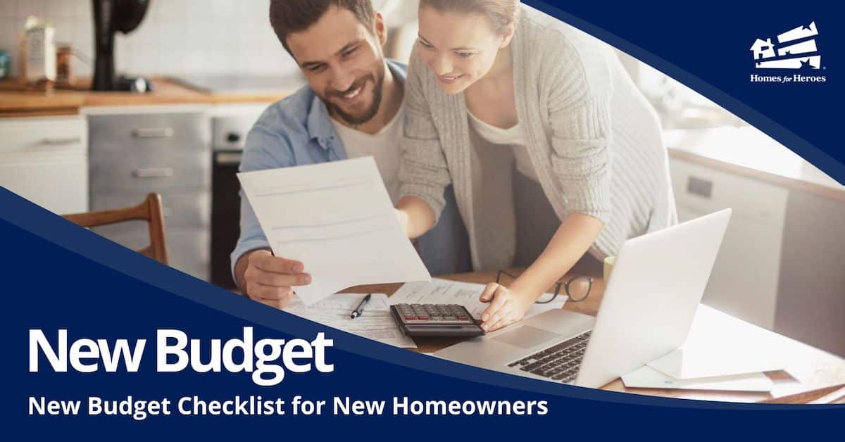 young man woman couple at kitchen table documents calculator laptop working on new home budget Homes for Heroes