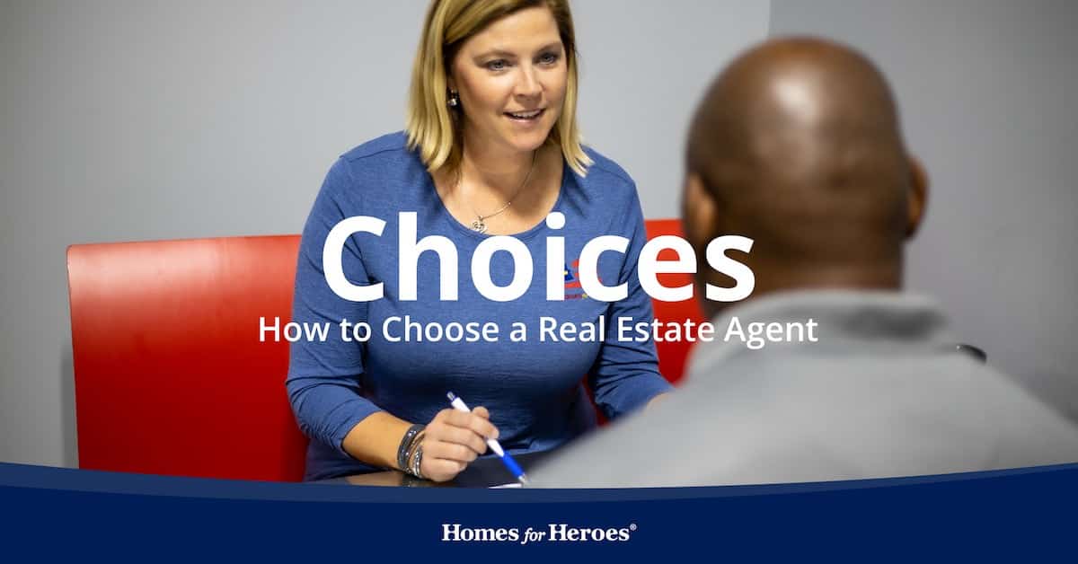 Homes for Heroes real estate agent meeting with home buyer who is wondering how to choose and buy home in office at desk