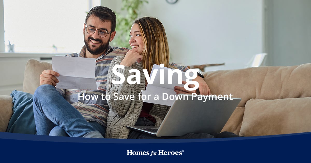 couple on couch with laptop talking about how to save for a down payment on a house